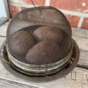 Primitive/Antique metal dish with tin cage of eggs